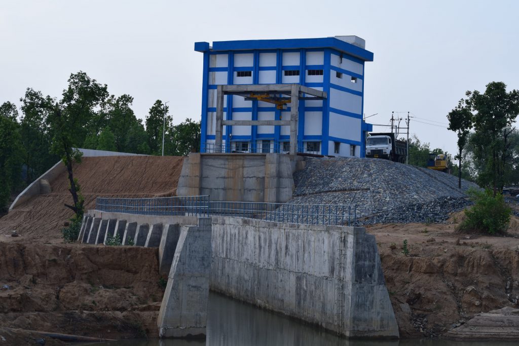 Blue intake pump house building on the Kurkut River for TRN Energy